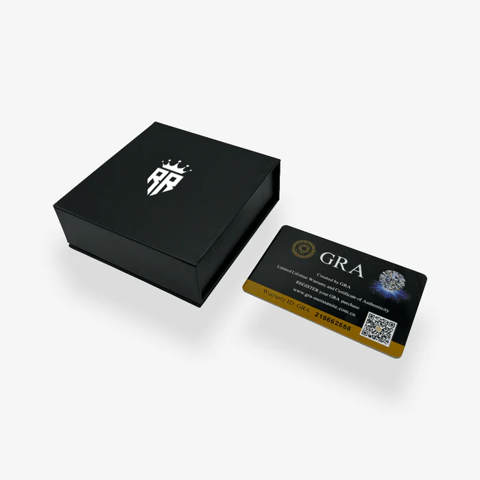 a black and gold business card in a black box